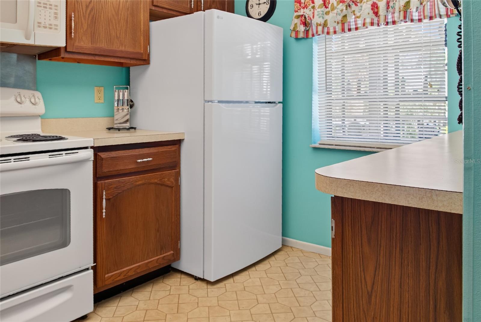 Brand new refrigerator with plenty of cabinet and counter space
