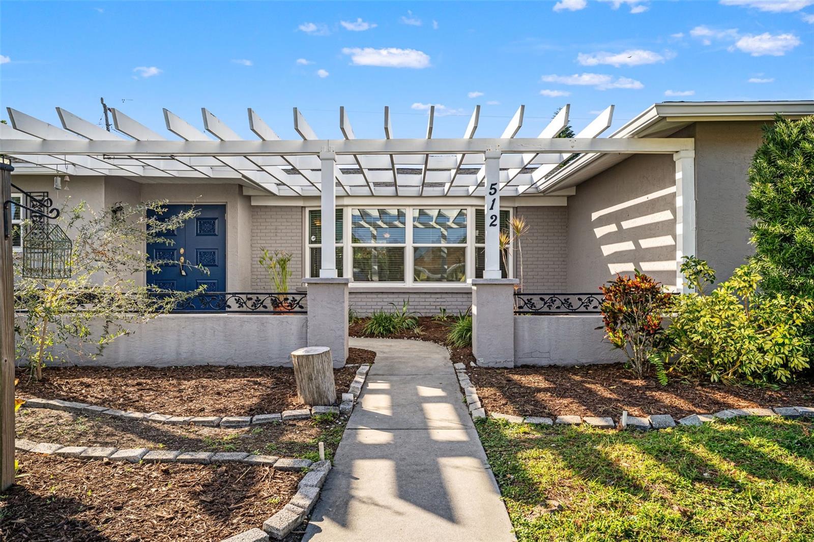 Front of home with pergola Front of home with pergola