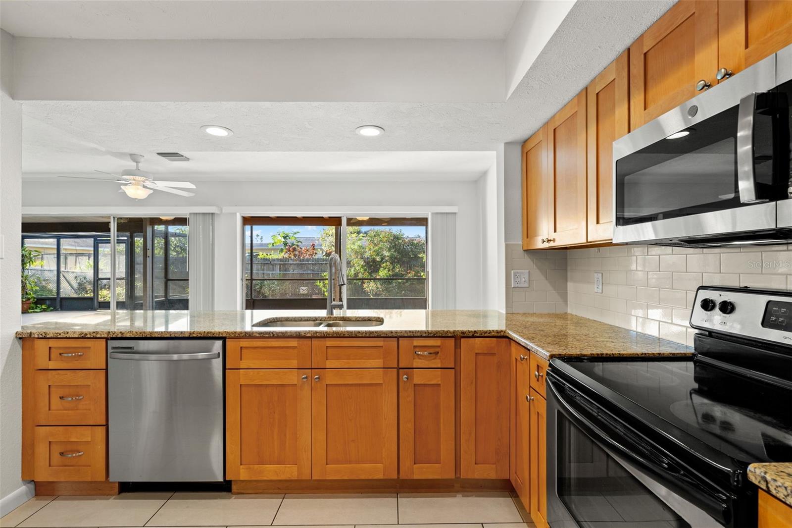 Updated kitchen with soft close cabinetry and recessed lighting