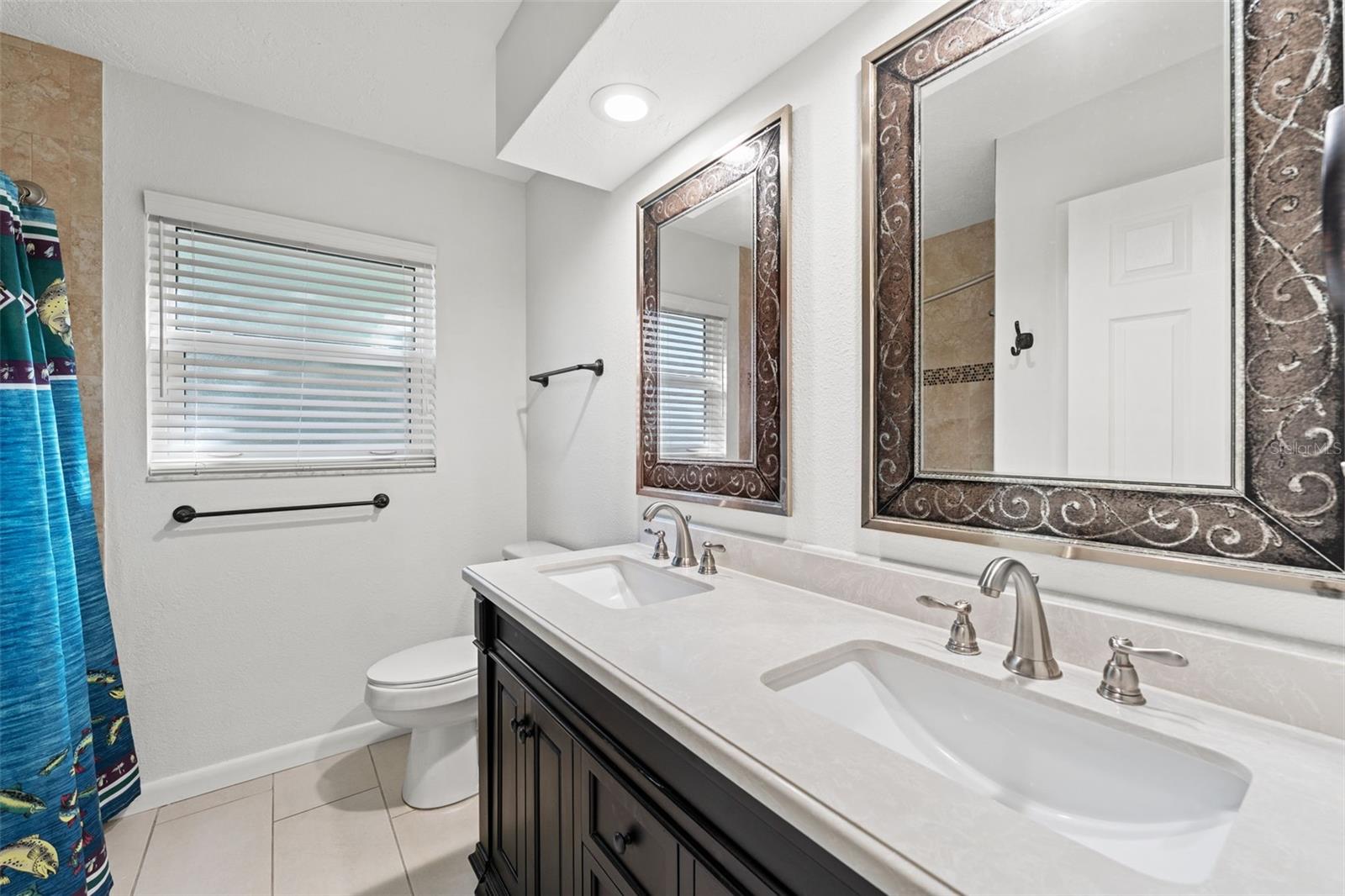 Updated double vanity and lighting in guest bath