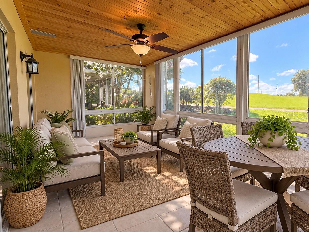 Virtually staged back lanai with windows and screens.