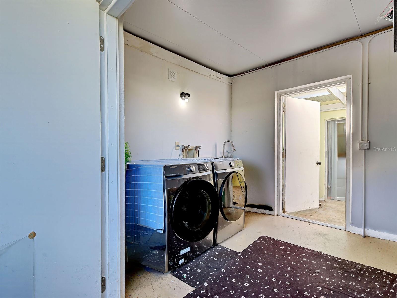 Laundry room is off of the front patio. Lots of room for storage.