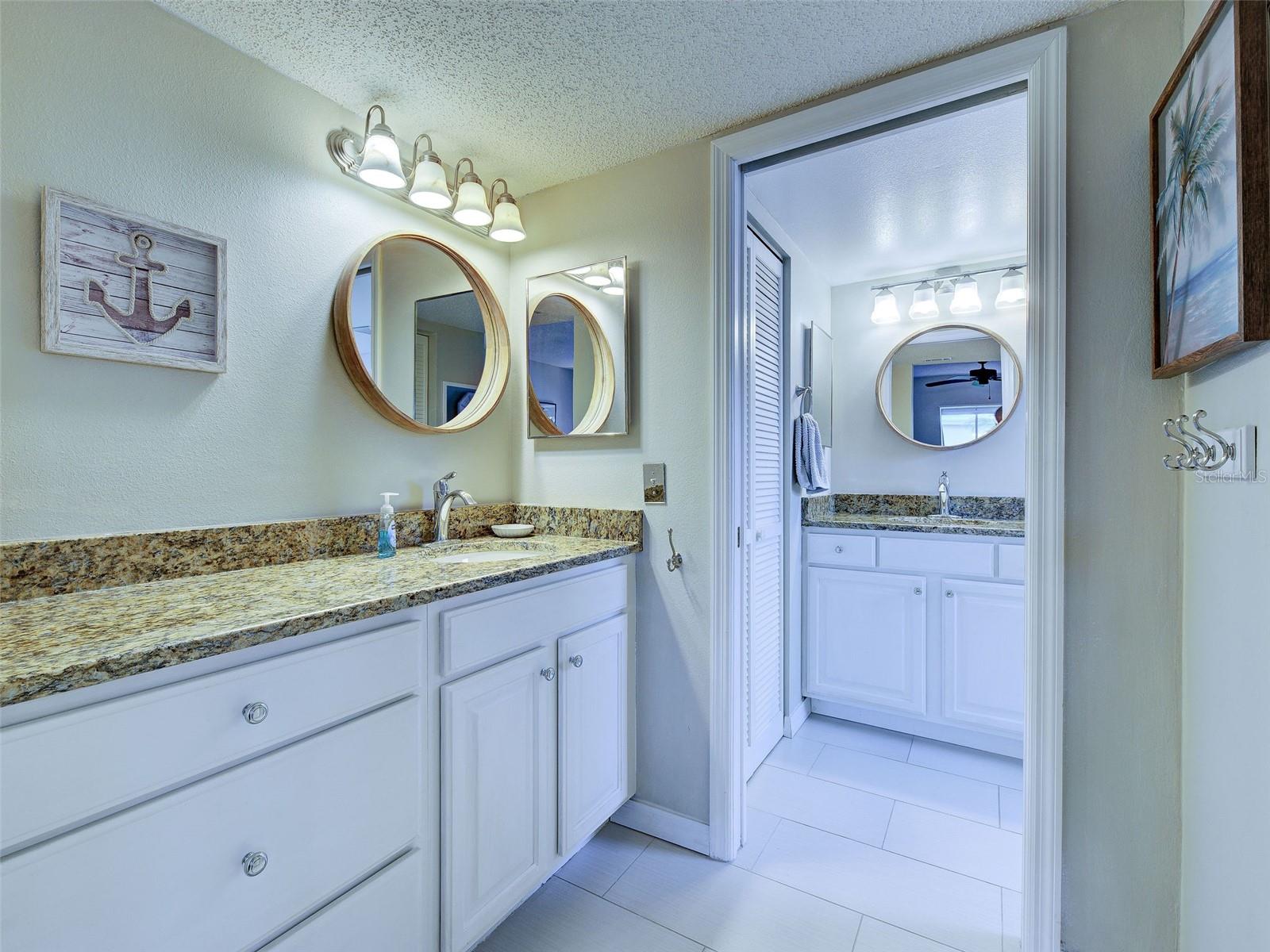 Primary Bath has dual sinks and separate vanities