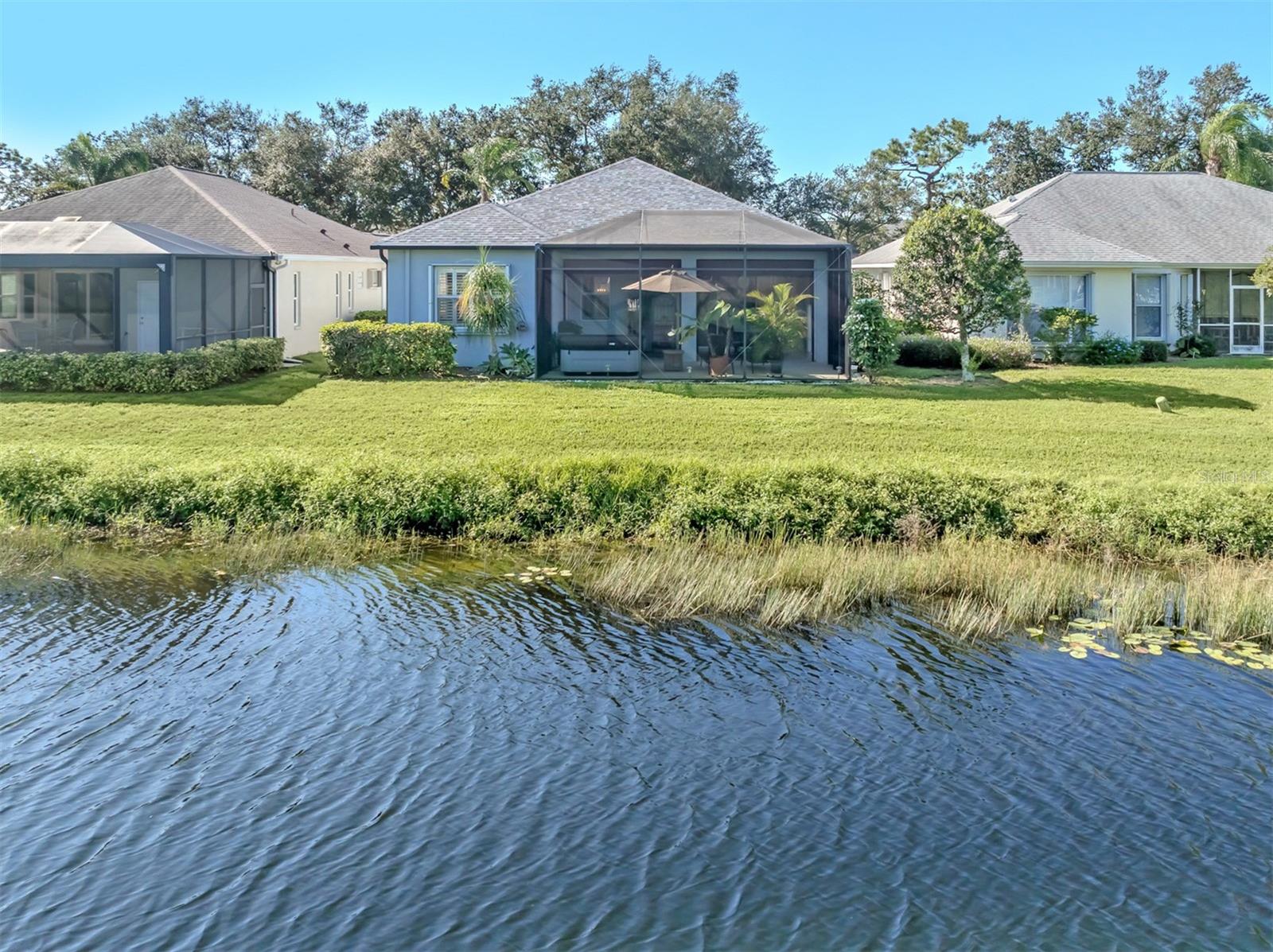 A lovely backyard setting with peaceful lake views, creating the perfect backdrop for relaxing and enjoying the beauty of Florida living! A lovely backyard setting with peaceful lake views, creating the perfect backdrop for relaxing and enjoying the beauty of Florida living!
