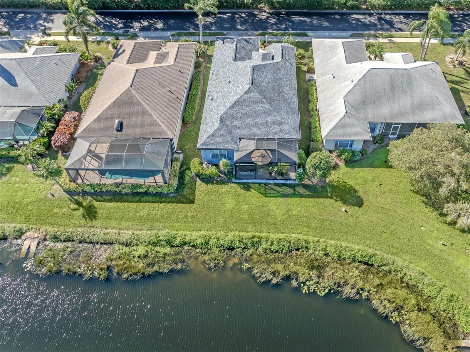 What a spectacular sight from above! Nestled among beautifully manicured surroundings with a glistening lake as its backdrop, this lovely home enjoys a setting that captures the very best of Florida's natural beauty!
