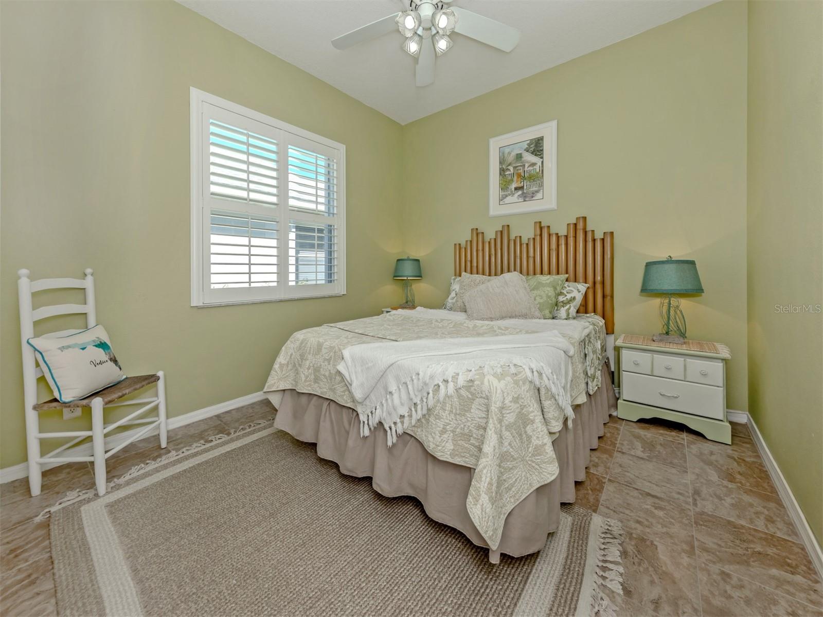 Sweet dreams start here! This lovely guest bedroom is filled with warmth and charm, creating a welcoming haven where family and friends can settle in, feel right at home, and enjoy a little getaway of their own!