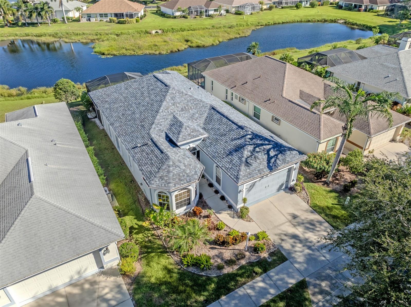 Imagine trading the hustle and bustle for a home surrounded by such lovely scenery! This bird's-eye view captures a delightful balance of neighborhood charm, waterfront beauty, and the easygoing lifestyle that makes Venice, Florida, so irresistible!