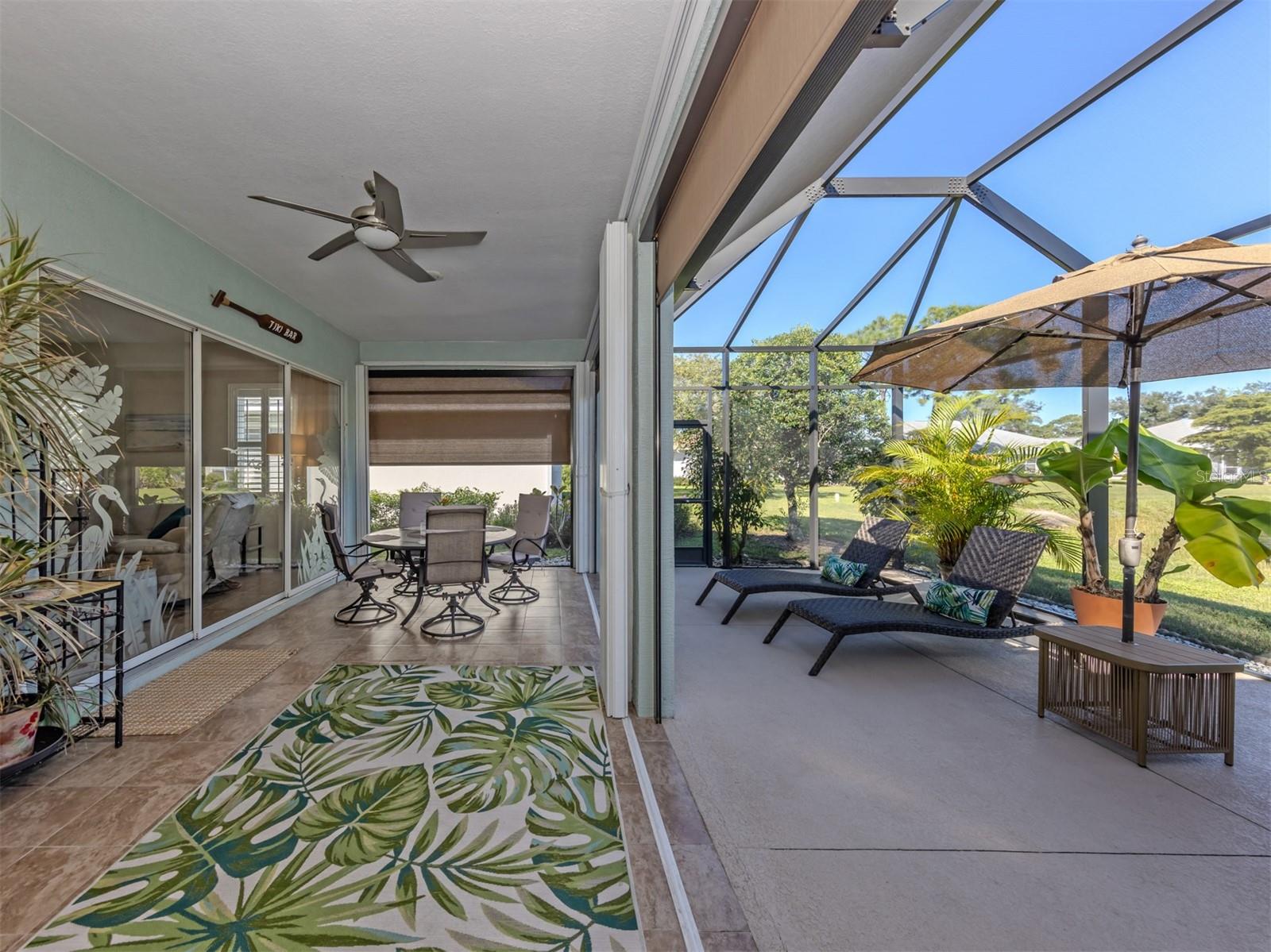 Your favorite room might just be outdoors! Enjoy dinner beneath the covered lanai, then wander into the spacious screened extension to catch the breeze. With the touch of a button, electric shades adjust to your liking, while already-installed hurricane shutters slide shut when needed. It's outdoor living made wonderfully easy!