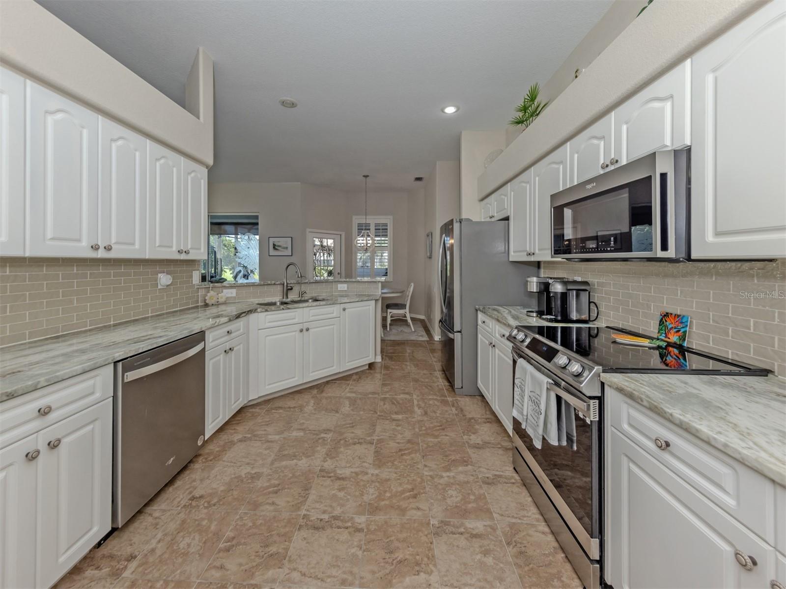 Where style meets everyday convenience! This thoughtfully designed kitchen offers generous counter space, an inviting layout, and all the little touches that make cooking and entertaining a pleasure!