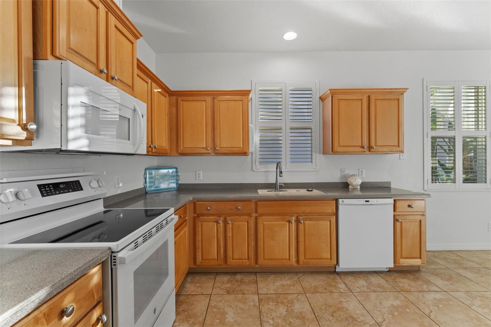Around the corner from the Dining Room - Kitchen with Plantation Shutters
