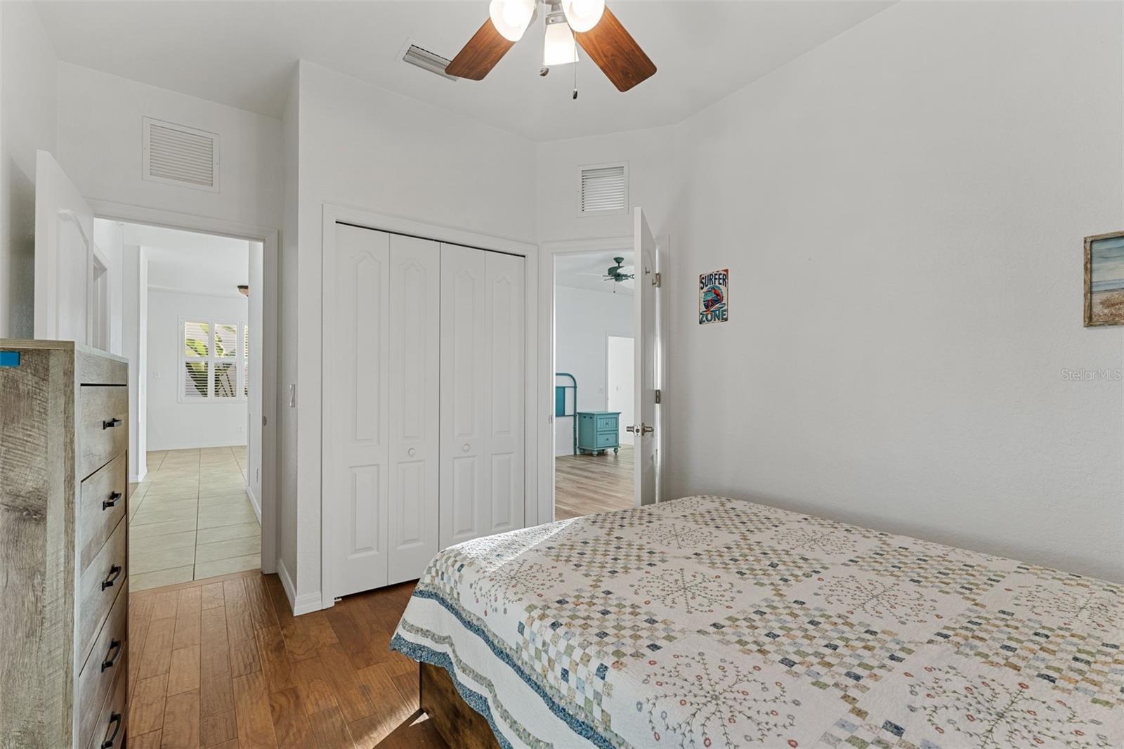 Entrance to hallway on the left, to the Primary Bedroom on the right