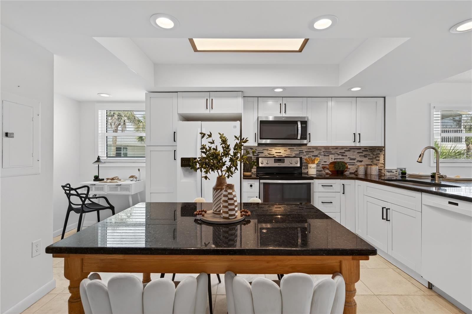 Open Plan Kitchen with Office Nook, Granite Counters and Breakfast Bar Open Plan Kitchen with Office Nook, Granite Counters and Breakfast Bar