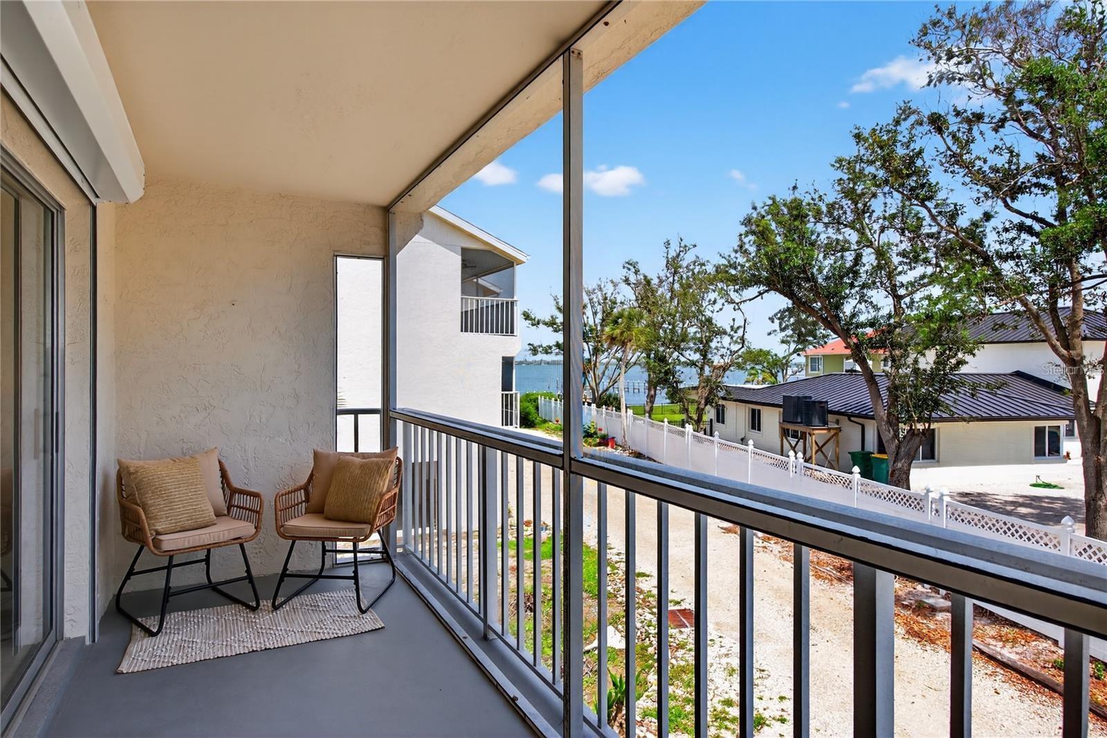 Lanai Directly Off of Living Room and Primary Bedroom with Peekaboo Views to Lemon Bay