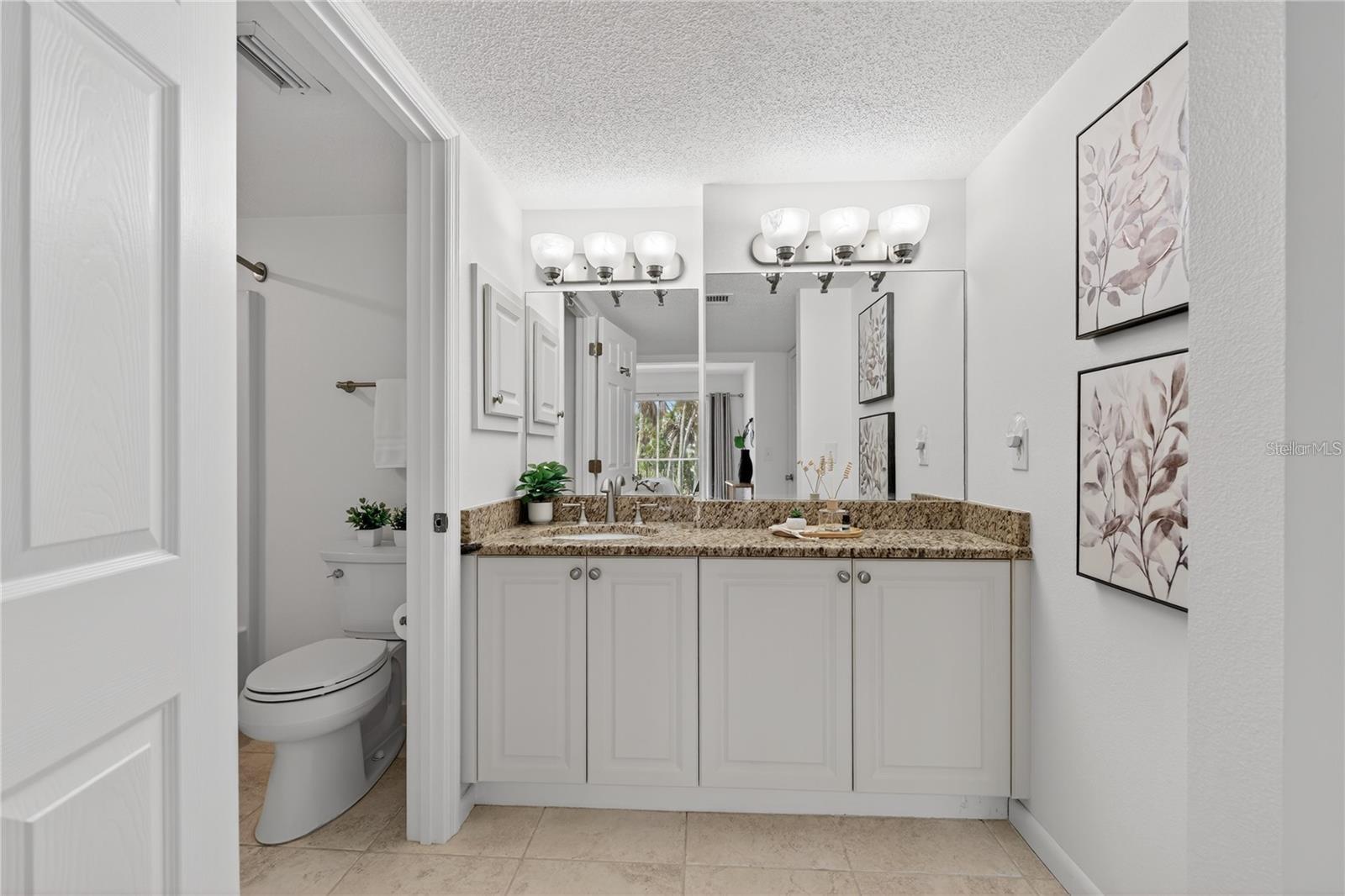 Primary Bathroom with Large Granite-Topped Vanity
