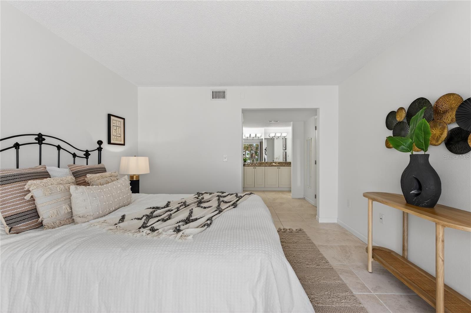 Primary Bedroom with Ensuite Bathroom and Walk-In Closet