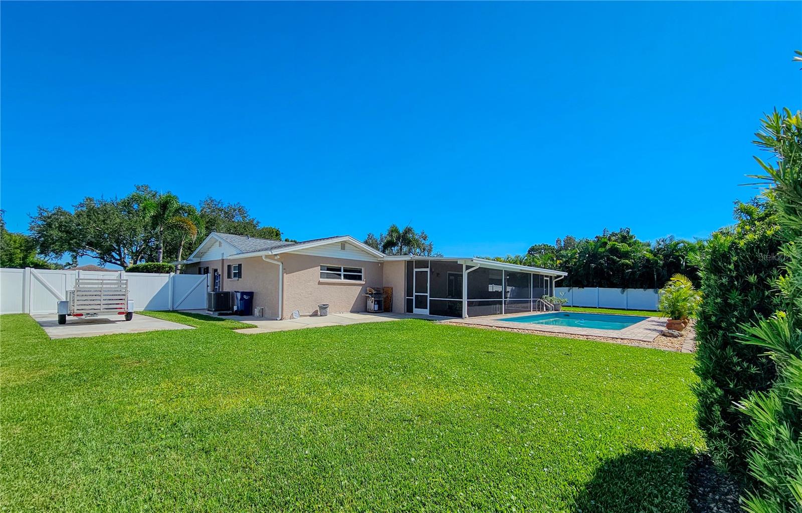 Fenced in Backyard from shed with RV/Boating parking pad behind double door fence