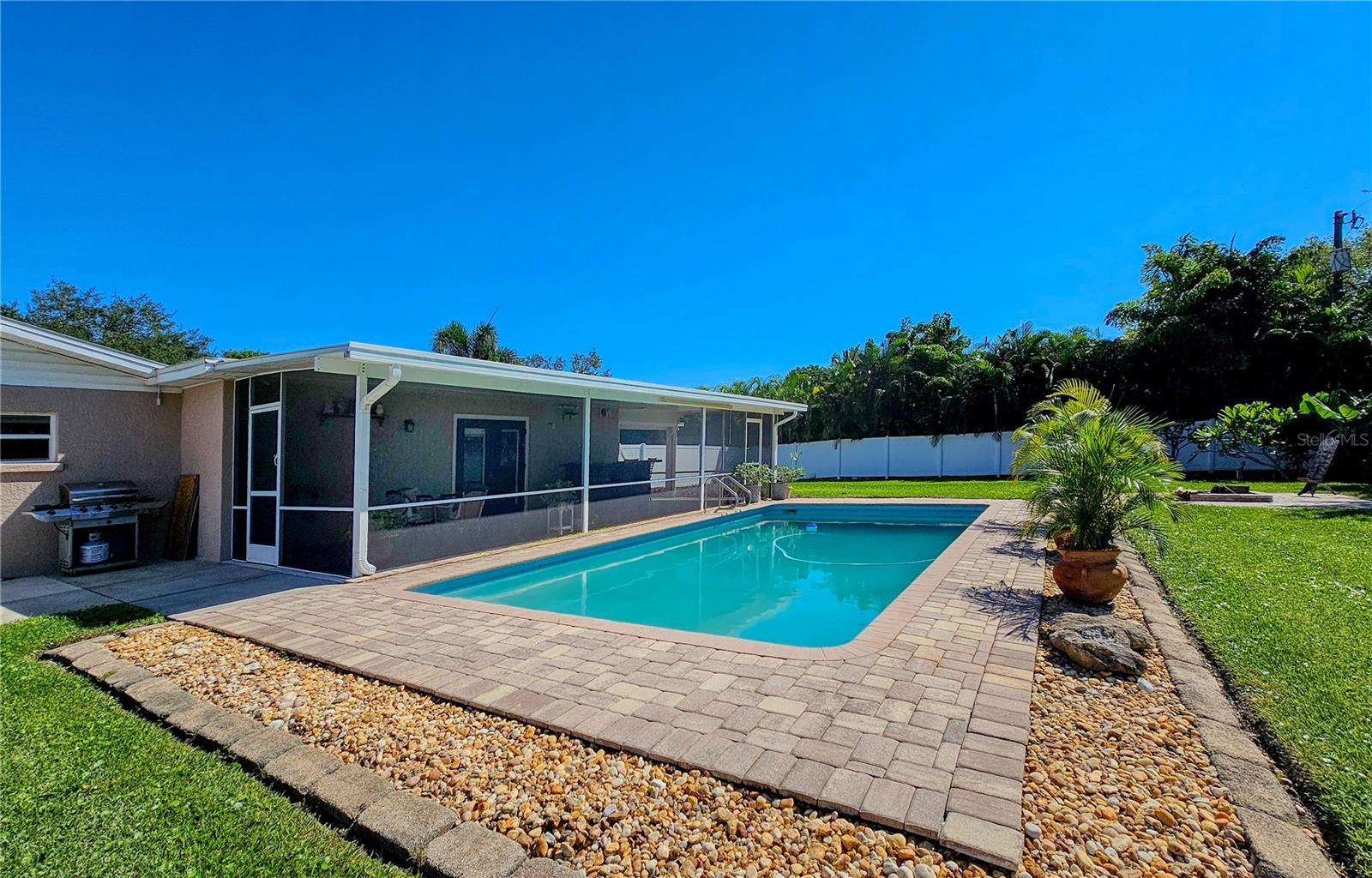 Brick Paver patio around freshwater 15 ' x 30' pool