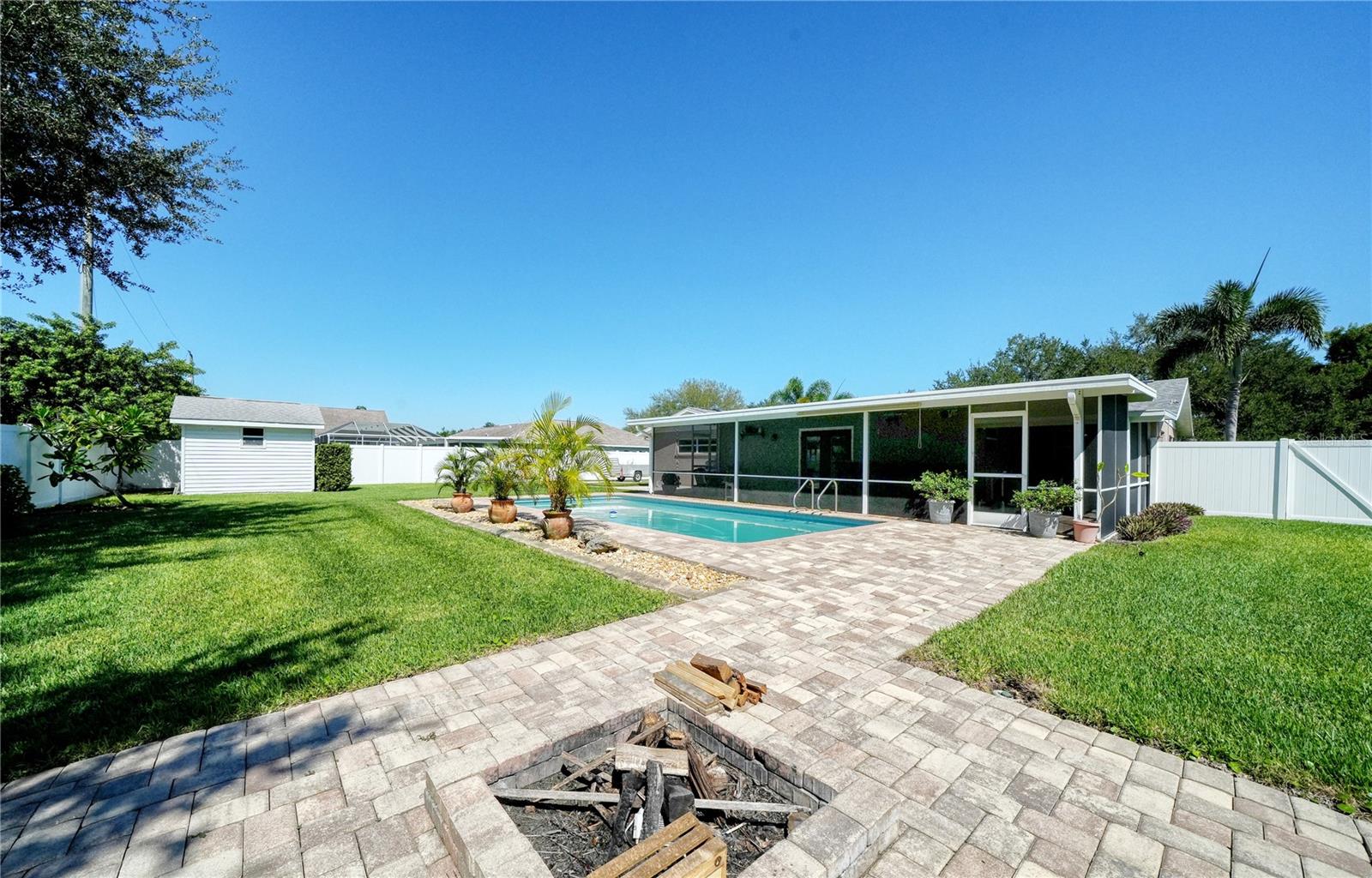 Firepit toward pool & Florida Room