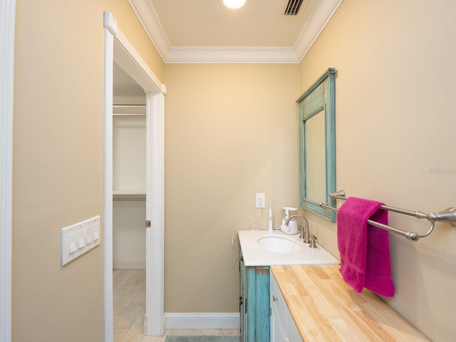 primary bath with 2nd vanity across from walk in closet