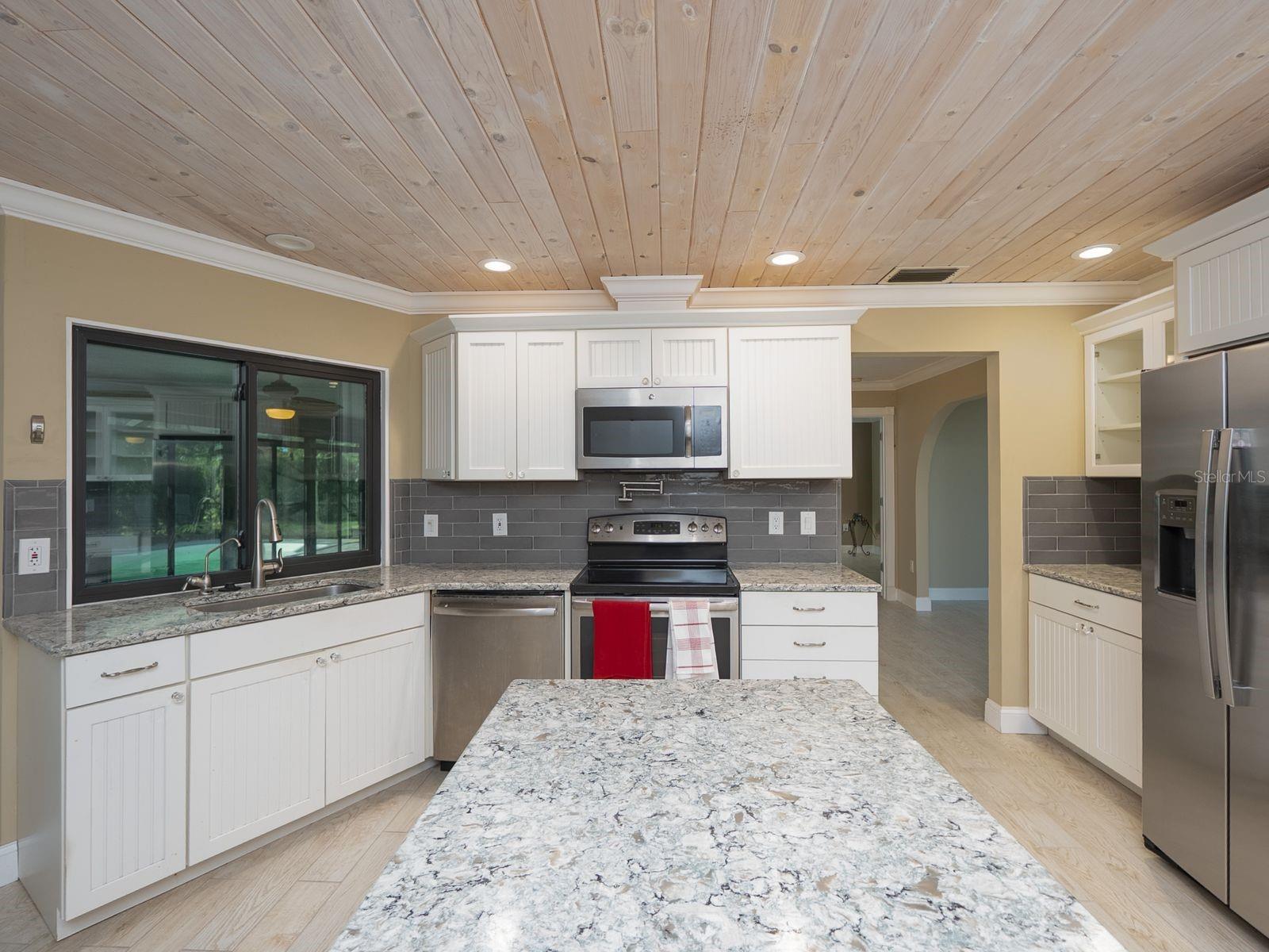 kitchen with passthrough to fl room- lanai
