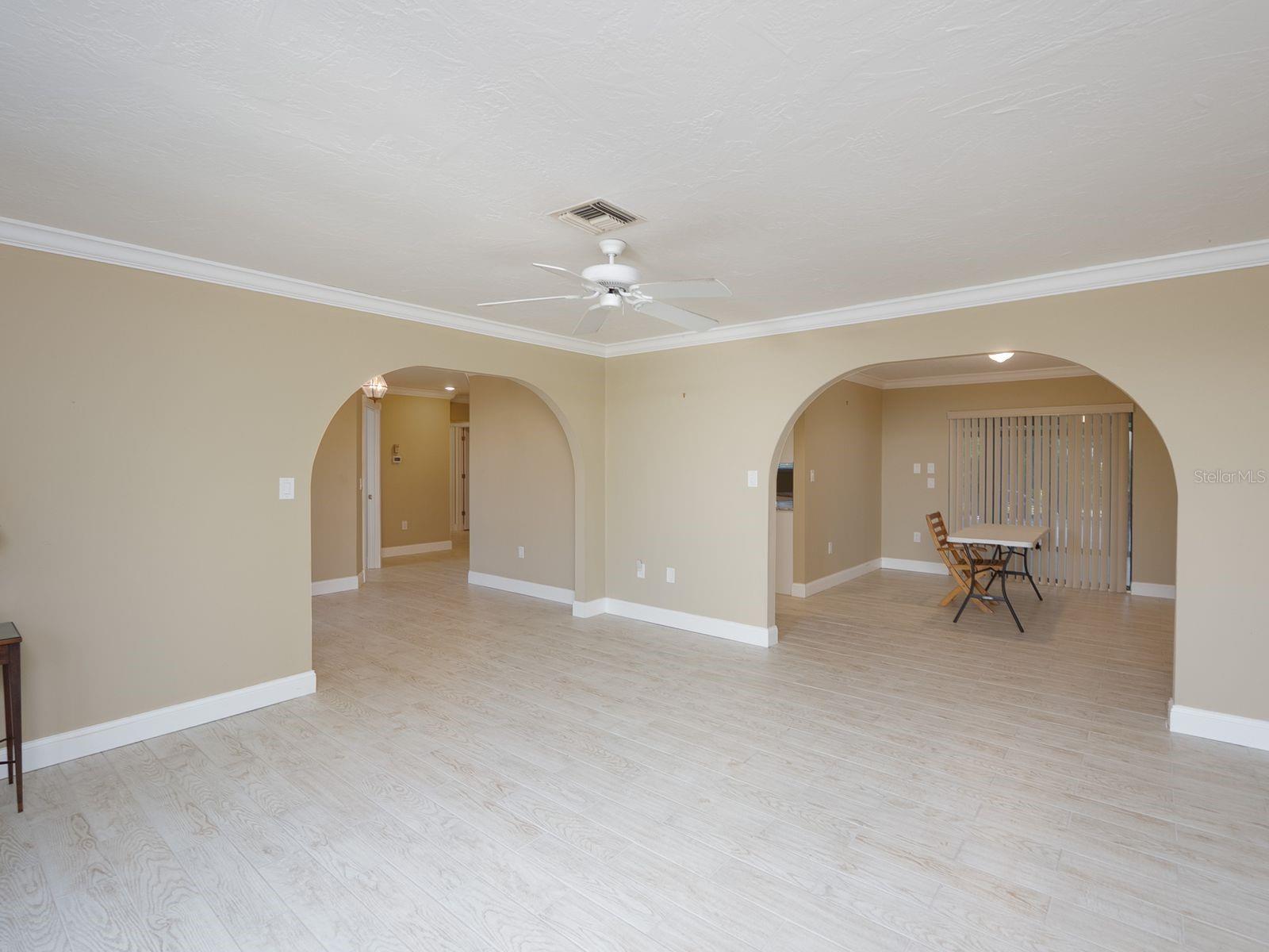 living room looking toward foyer left and dining right