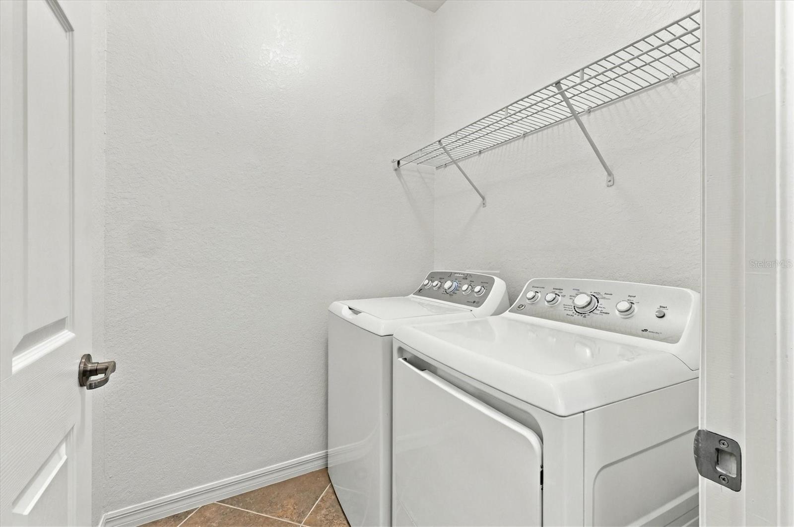Inside Laundry Room w/ Washer & Dryer