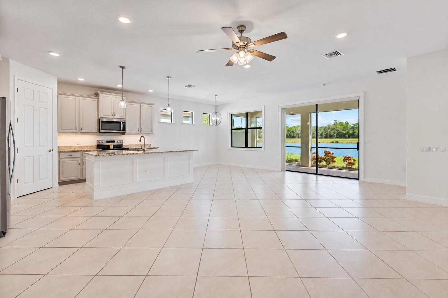 Open concept living / dining / kitchen Open concept living / dining / kitchen