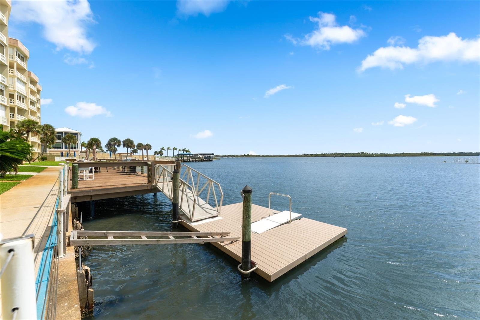 Floating dock launch for kayaks, canoes and other water toys