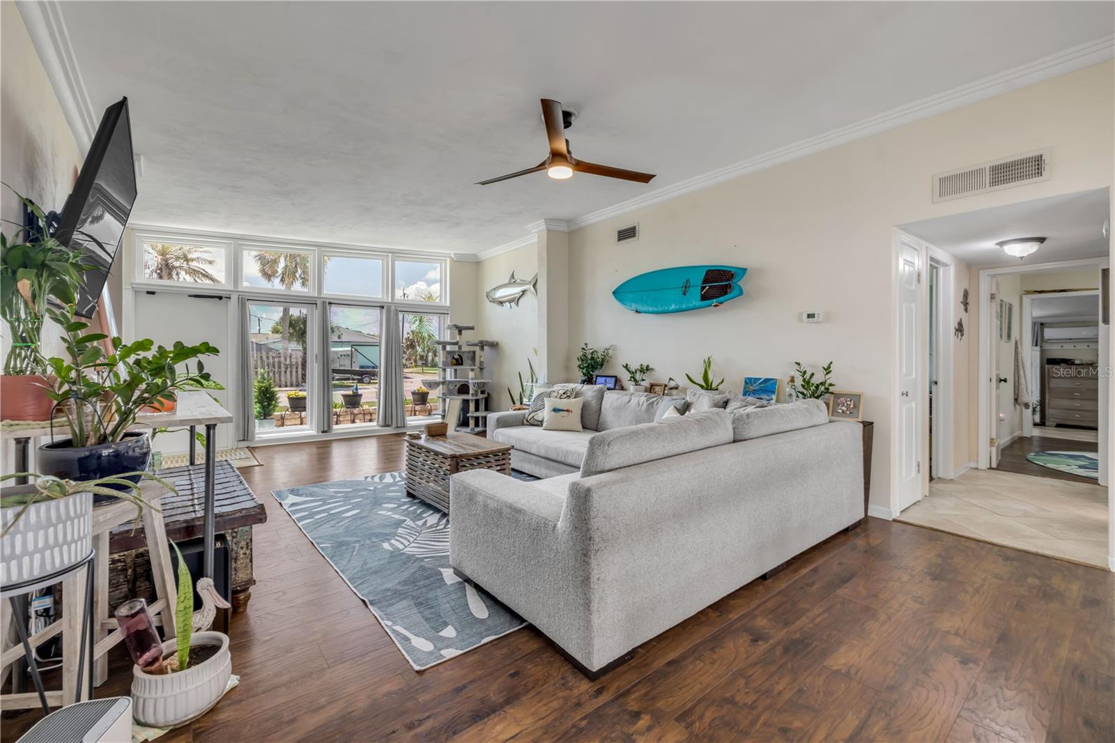 Living area with wood flooring and views toward the front windows.