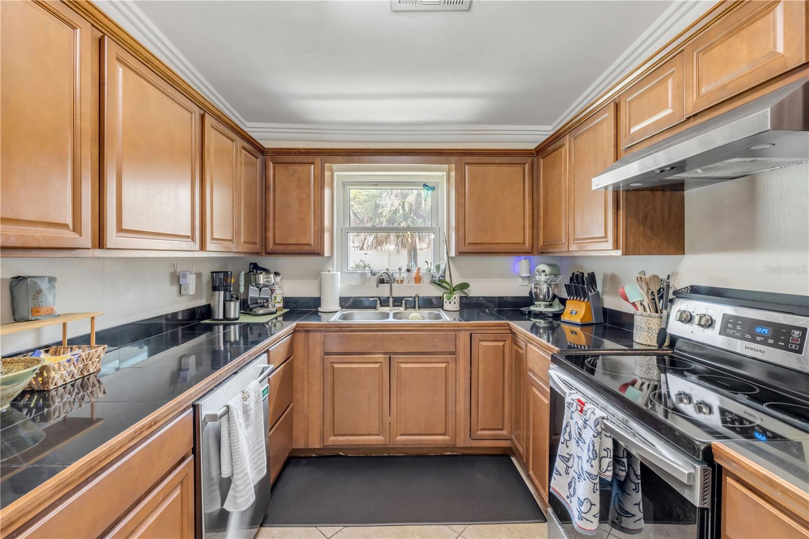 Kitchen view highlighting cabinet storage and counter space.