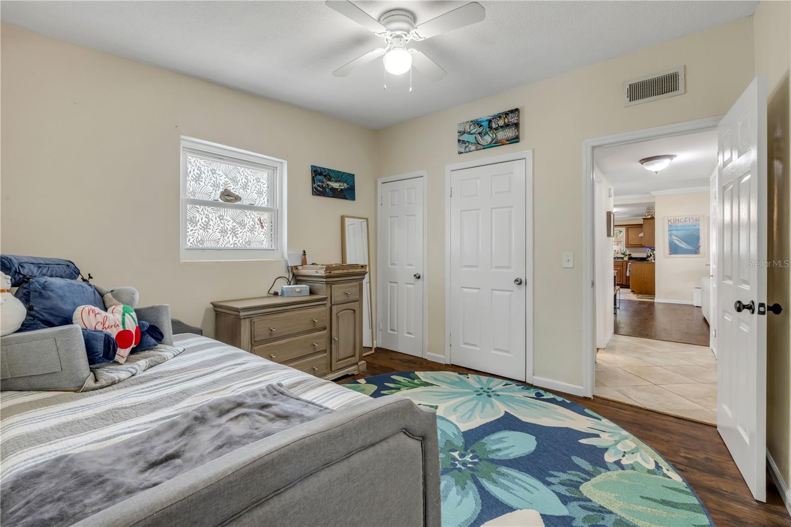 Alternate bedroom view showing the closet and room layout.