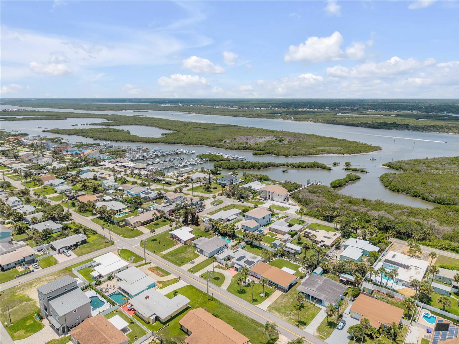 Wide aerial of the neighborhood and nearby waterways.