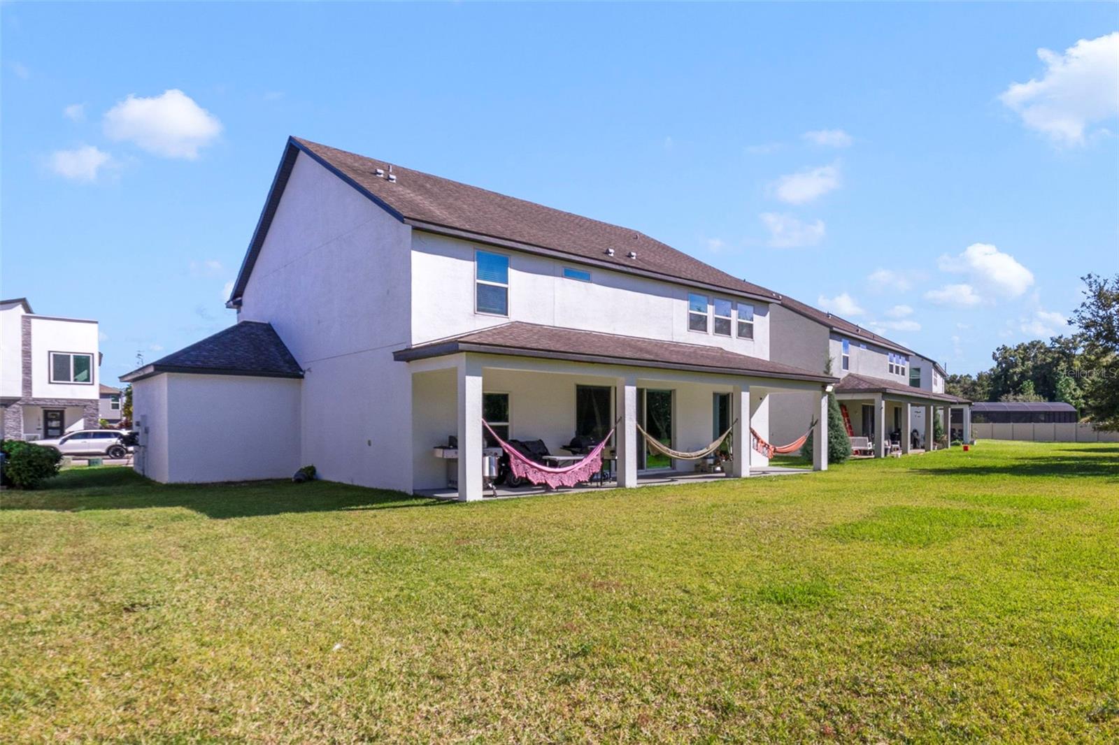 Outside, enjoy a large covered patio and an EXPANSIVE BACKYARD, ideal for future customization, gatherings, or play.