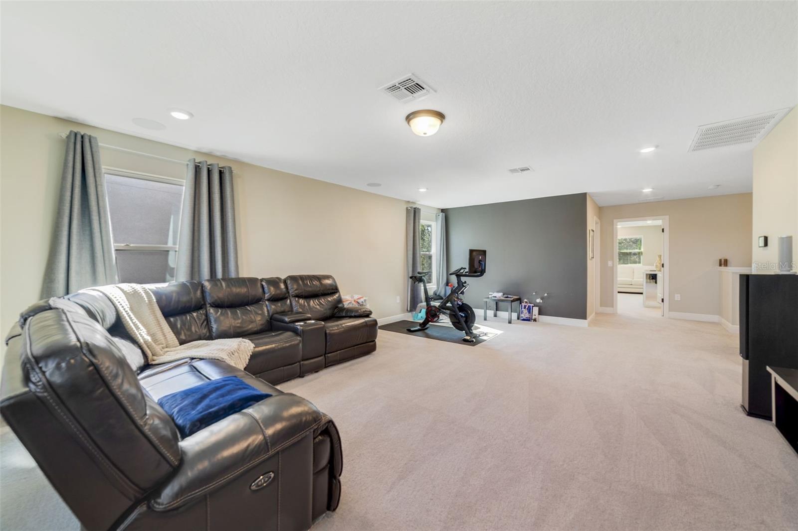 Upstairs, a GENEROUS LOFT creates a perfect secondary living area.