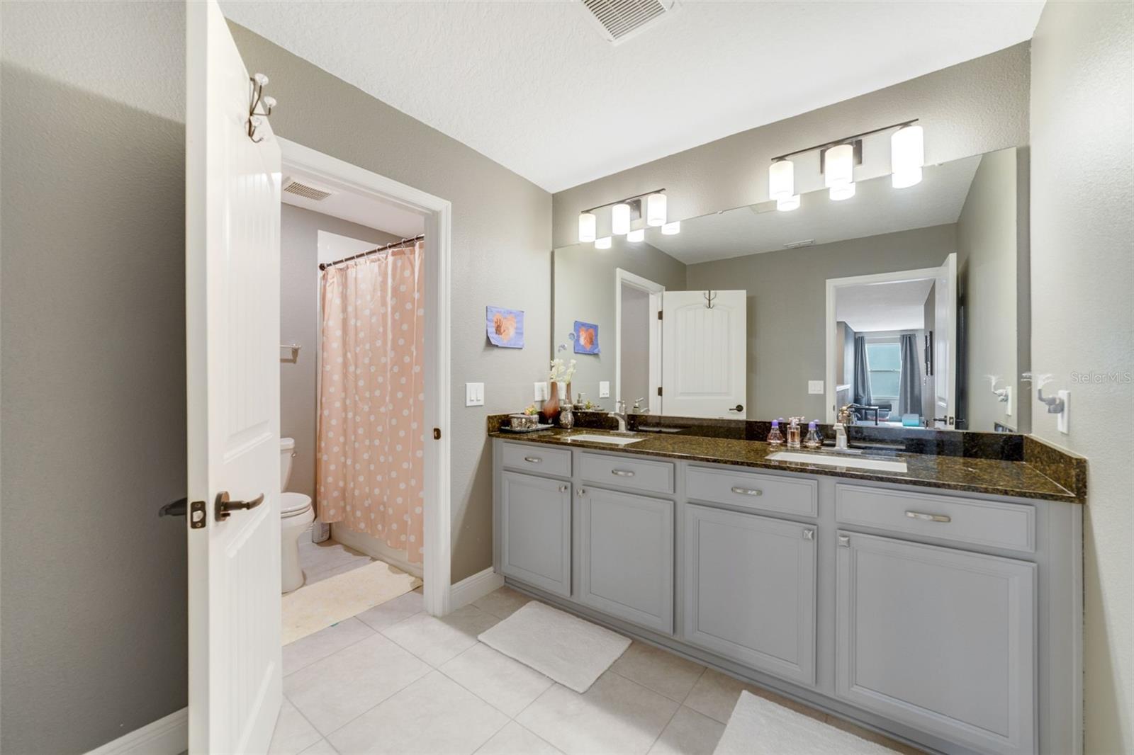 Three additional bedrooms and another full bath offer plenty of comfortable space for family and guests.