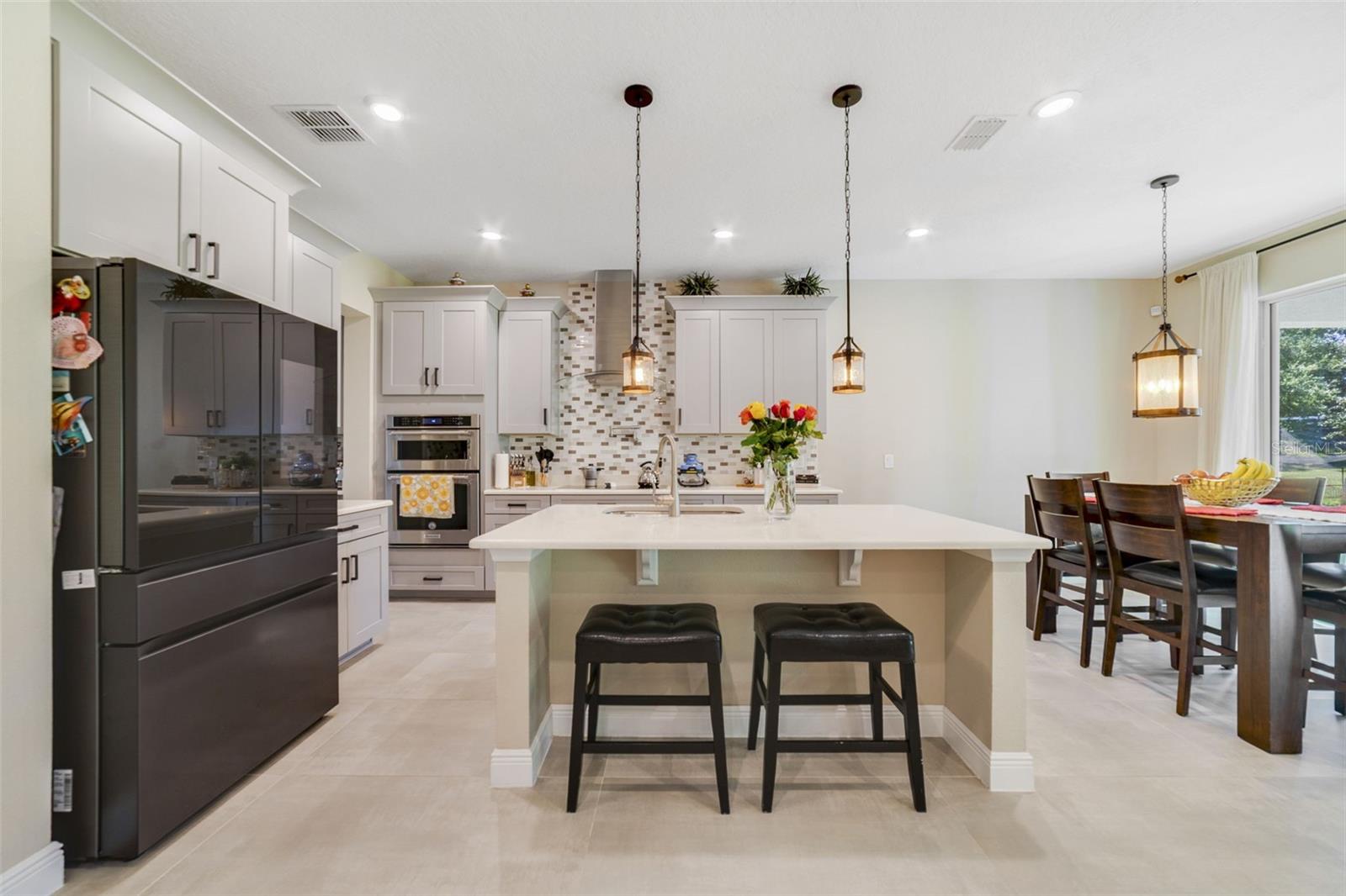 A generous center island brings extra prep space and room for counter-height seating. A generous center island brings extra prep space and room for counter-height seating.