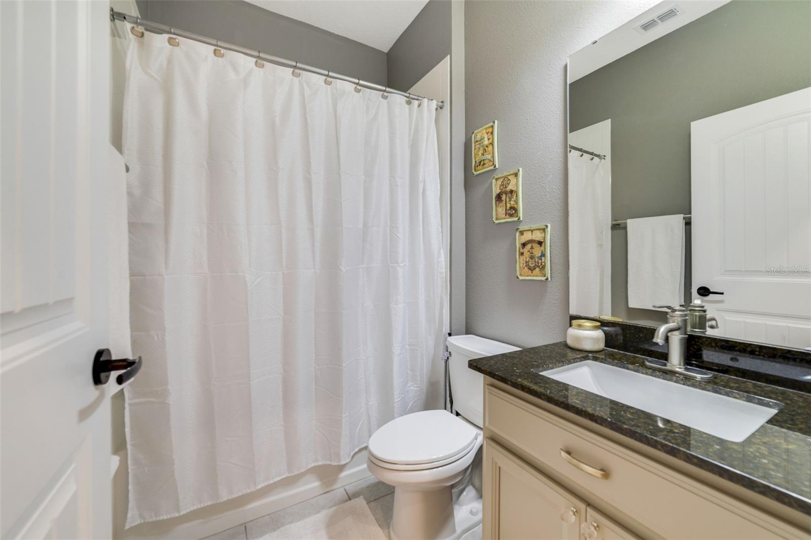 A functional first-floor full Bath offers everything you need for daily convenience and guest use.