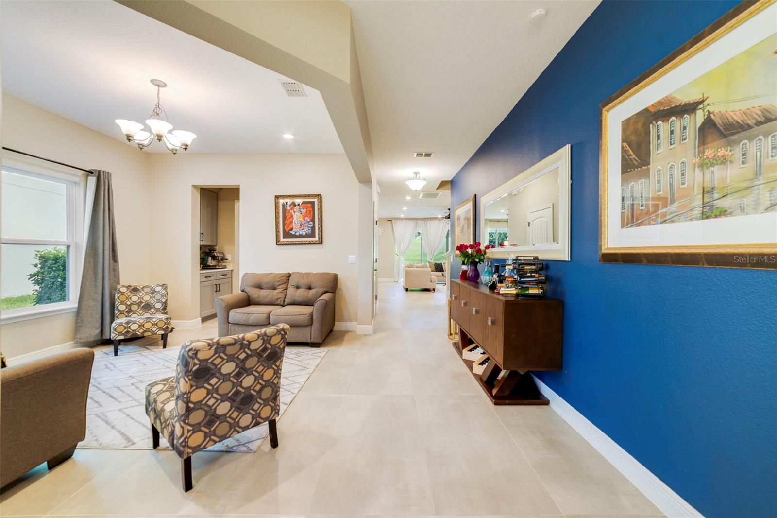 A separate Dining room offers flexibility for family gatherings or can easily serve as a formal Living room.