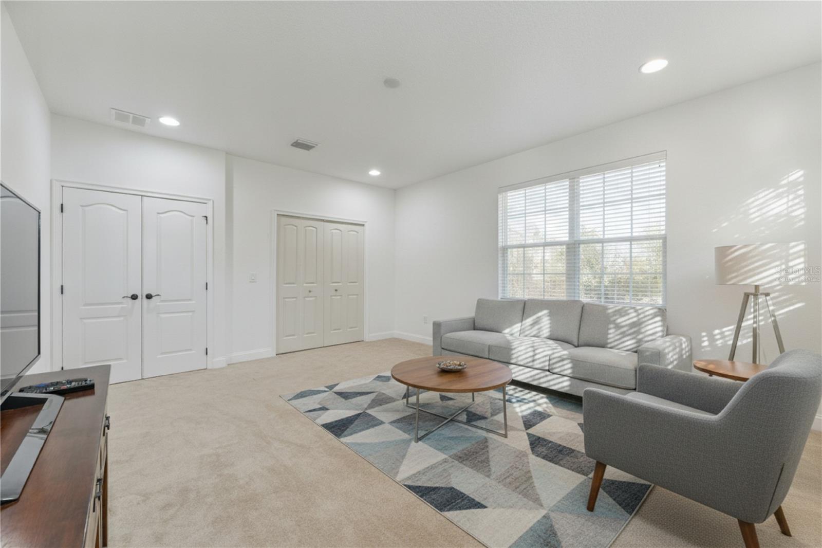 This could be a Fifth bedroom or a bonus room Virtually Staged