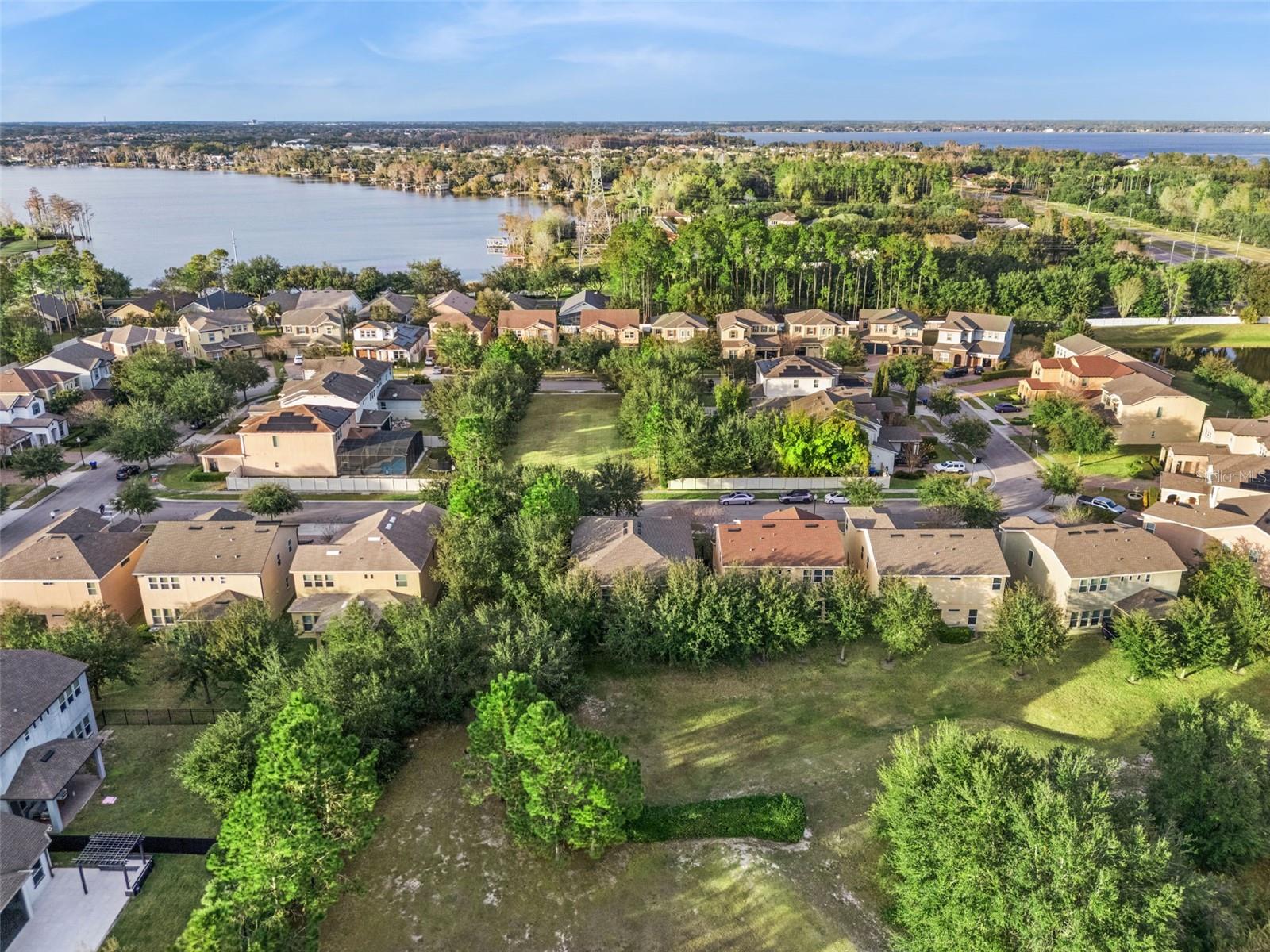 Rare privacy in Windermere  no rear neighbors, no front-facing neighbors, and no neighbor on the left side. Enjoy an open, peaceful setting with beautiful nearby lake views.