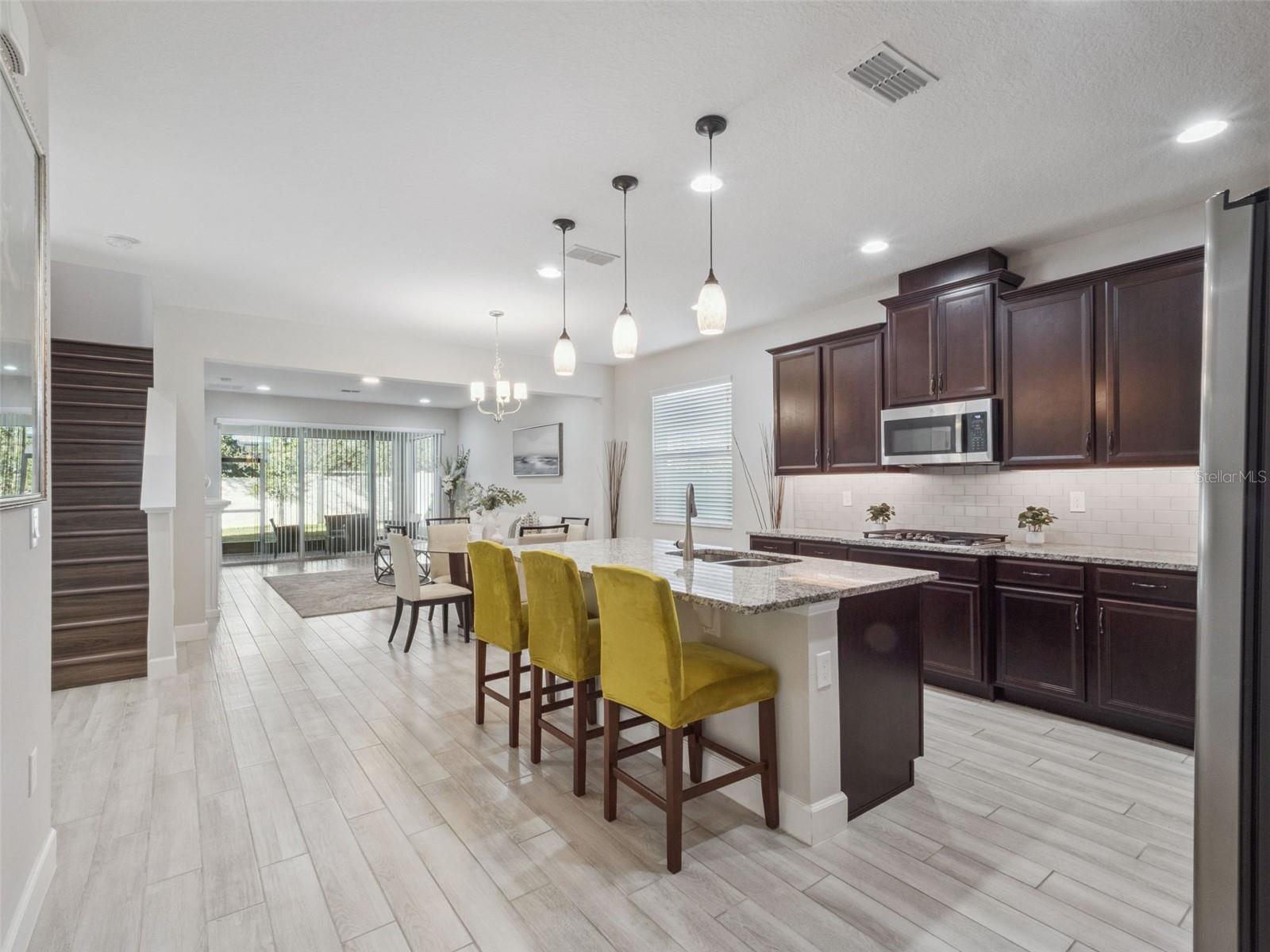 Beyond Foyer - Kitchen, Dining, Living Beyond Foyer - Kitchen, Dining, Living