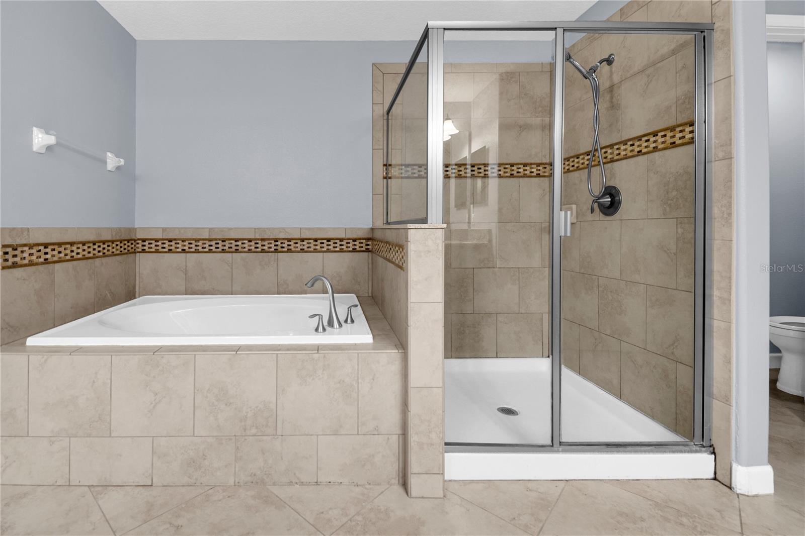 Upstairs Master Bathroom has a soaking tub and walk in shower