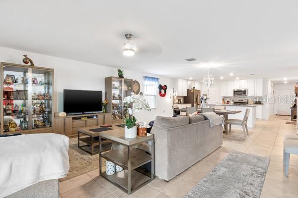 Living, dining and kitchen areas from exit to lanai
