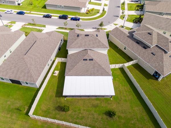 House from rear showing lanai (white) and rear yard (fenced) House from rear showing lanai (white) and rear yard (fenced)