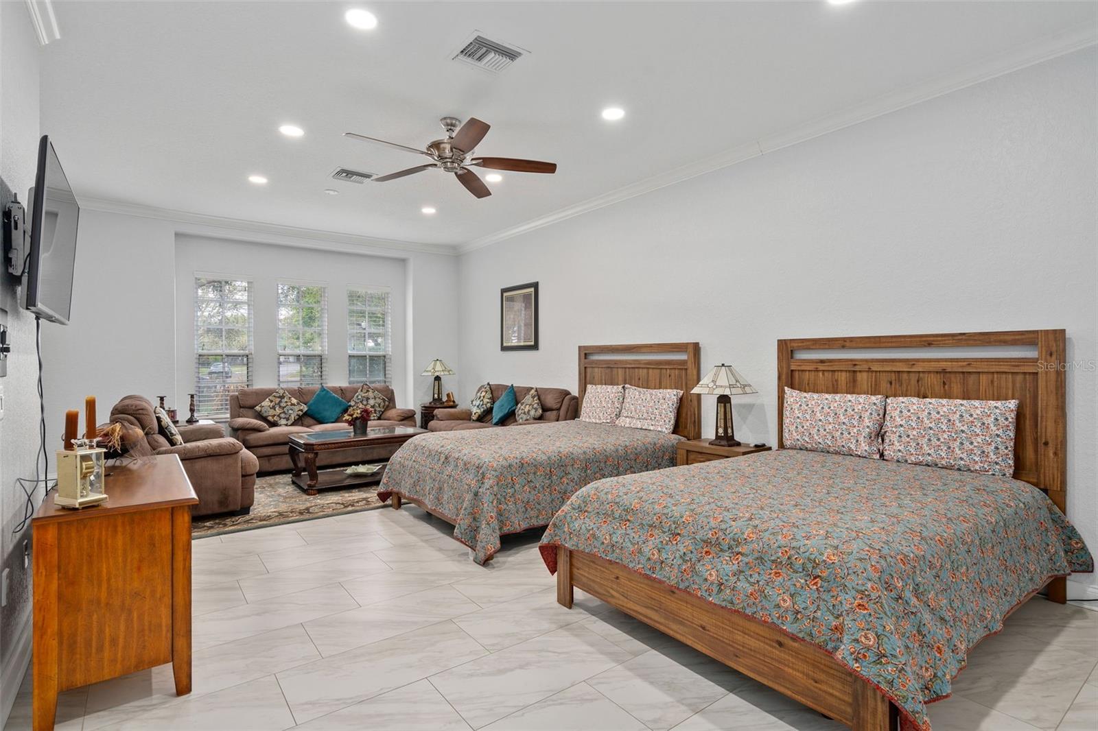 Downstairs Primary Bedroom with large sitting area. Has a door leading outside so could be used as an in law suite as well.
