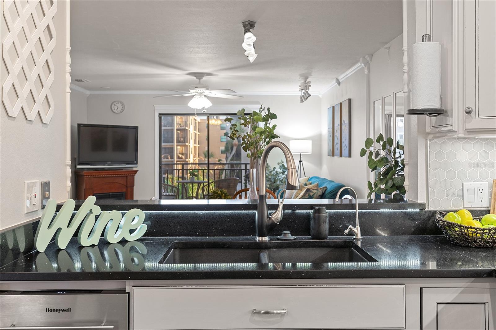 Kitchen sink overlooks living area Kitchen sink overlooks living area