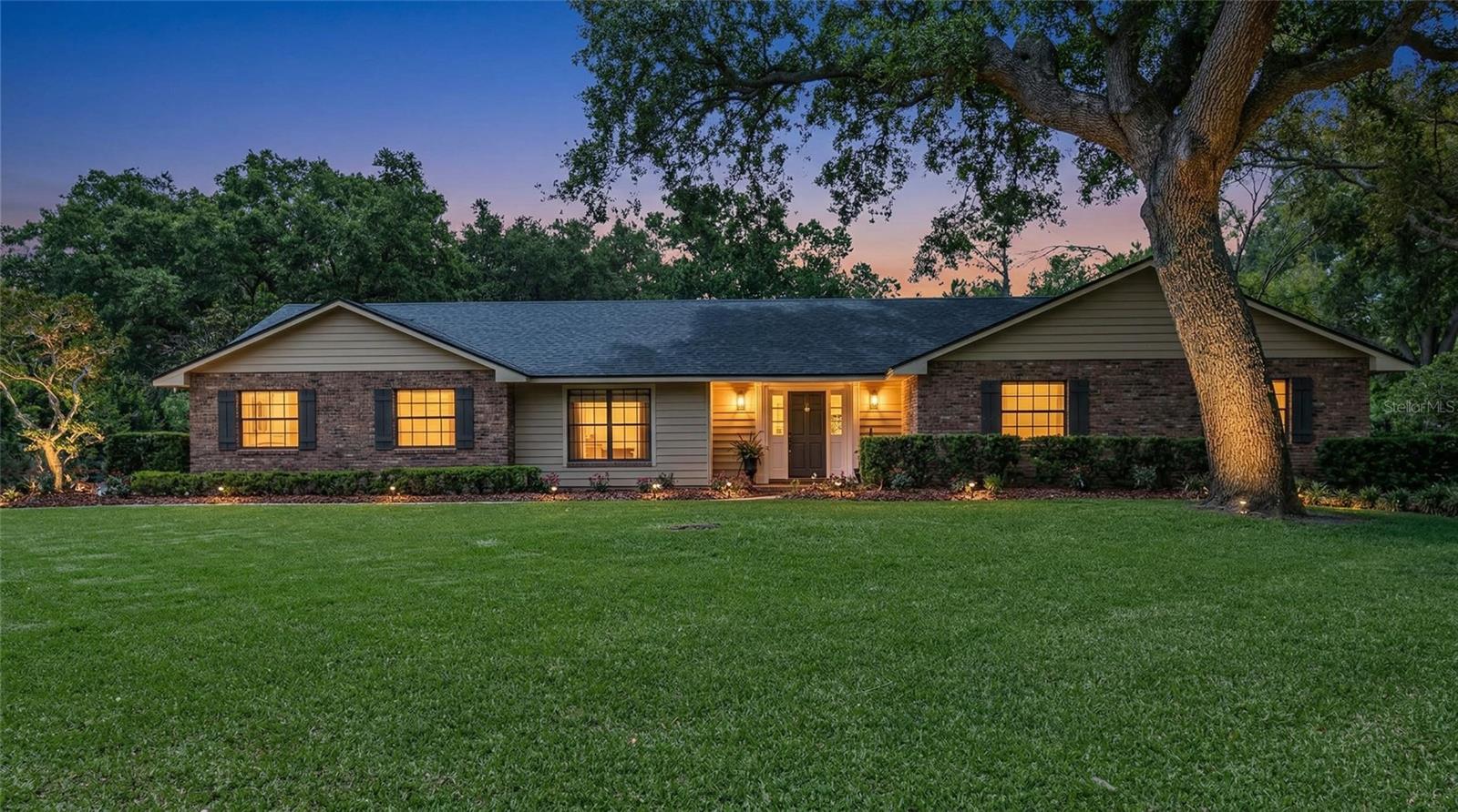 Welcome home to peaceful evenings and classic charm, with mature trees, inviting lighting, and exceptional curb appeal on a generously sized homesite.