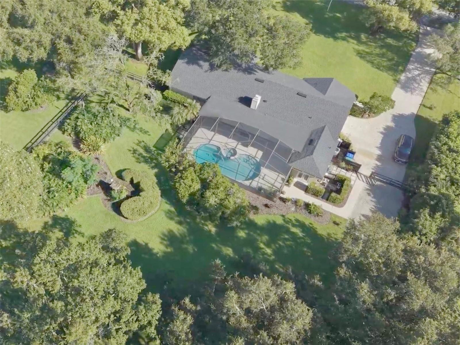 Pool home on over 1-acre lot with beautiful, mature approx 100-year-old oak trees.