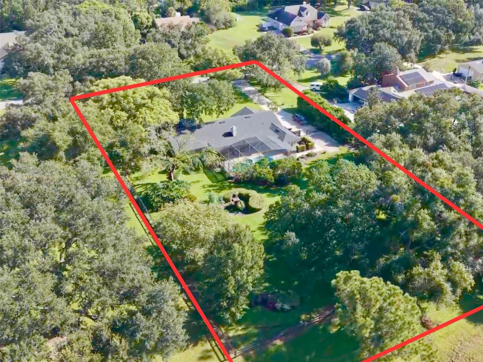 Pool home on over 1-acre lot with beautiful, mature approx 100-year-old oak trees.