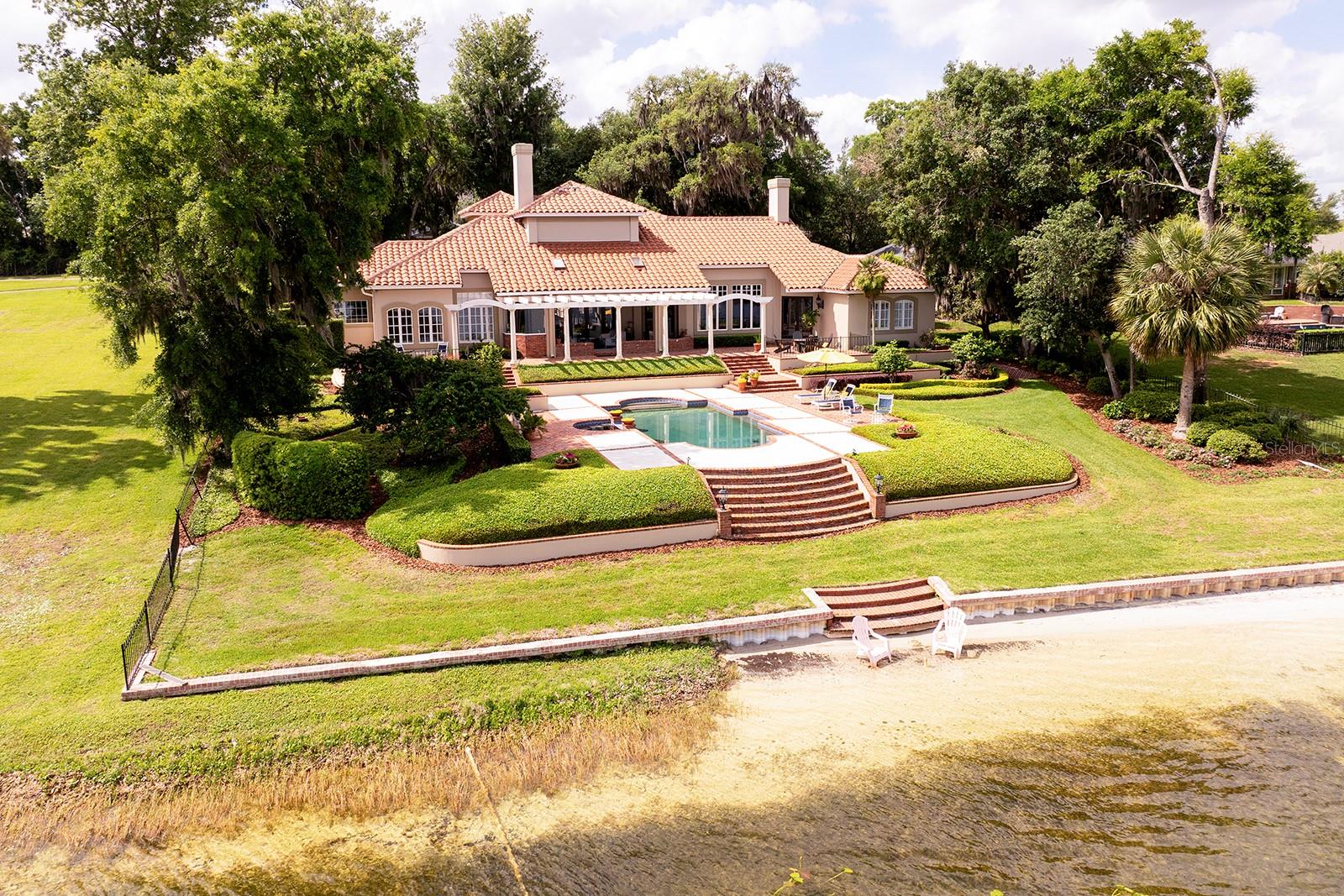 Spectacular grounds and luxury home, and this can all be yours. You can even build a sandcastle on your private beach.